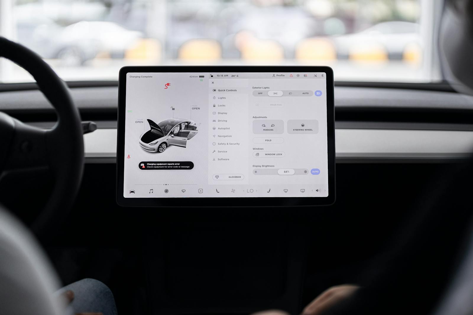 View of a modern car's dashboard featuring a digital display panel with control options.