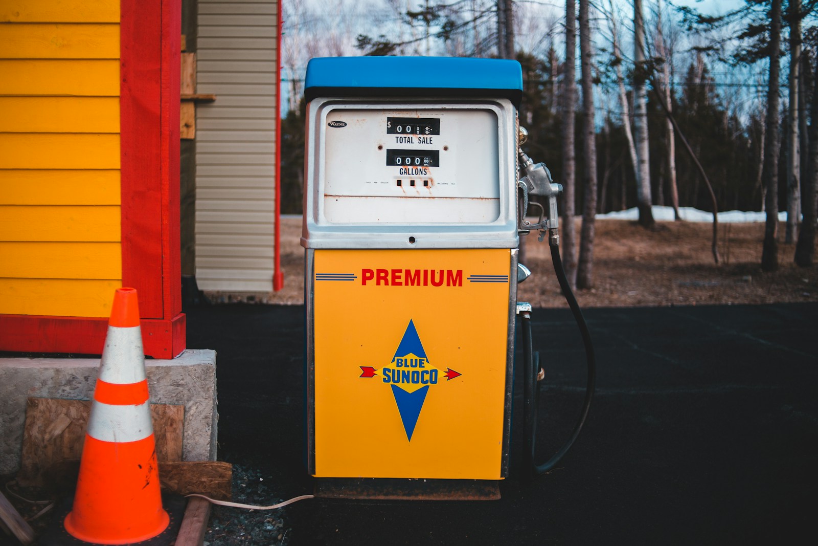 white and yellow Premium gasoline station