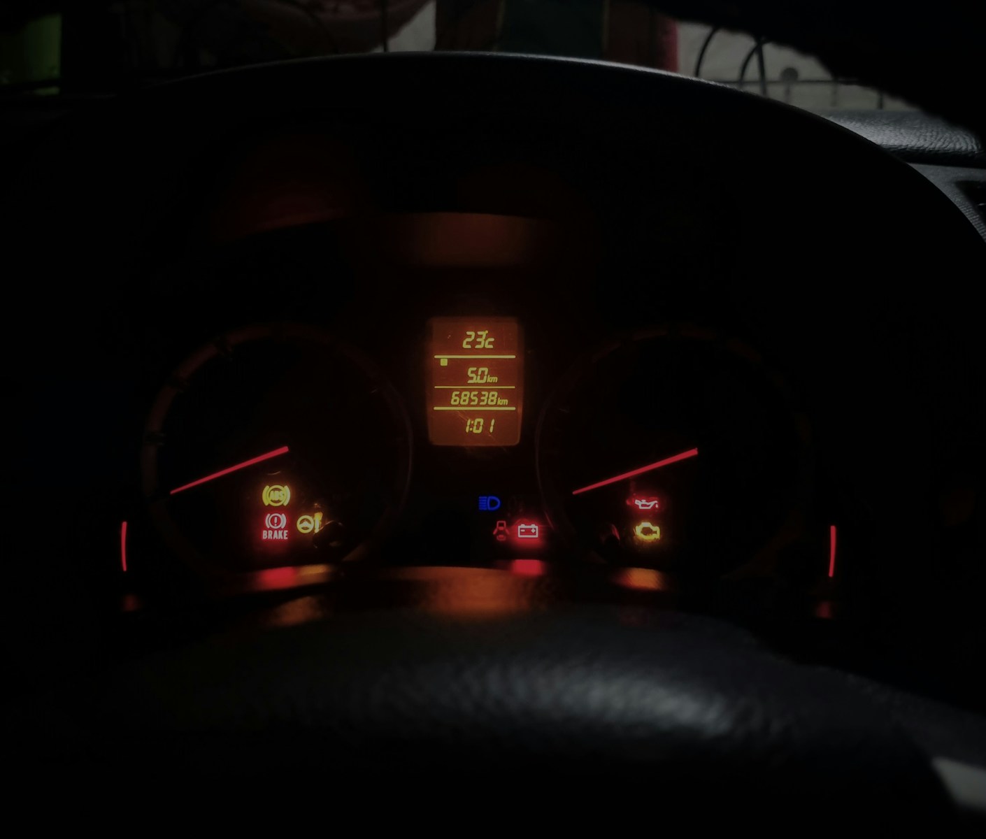 The dashboard of a car at night time
